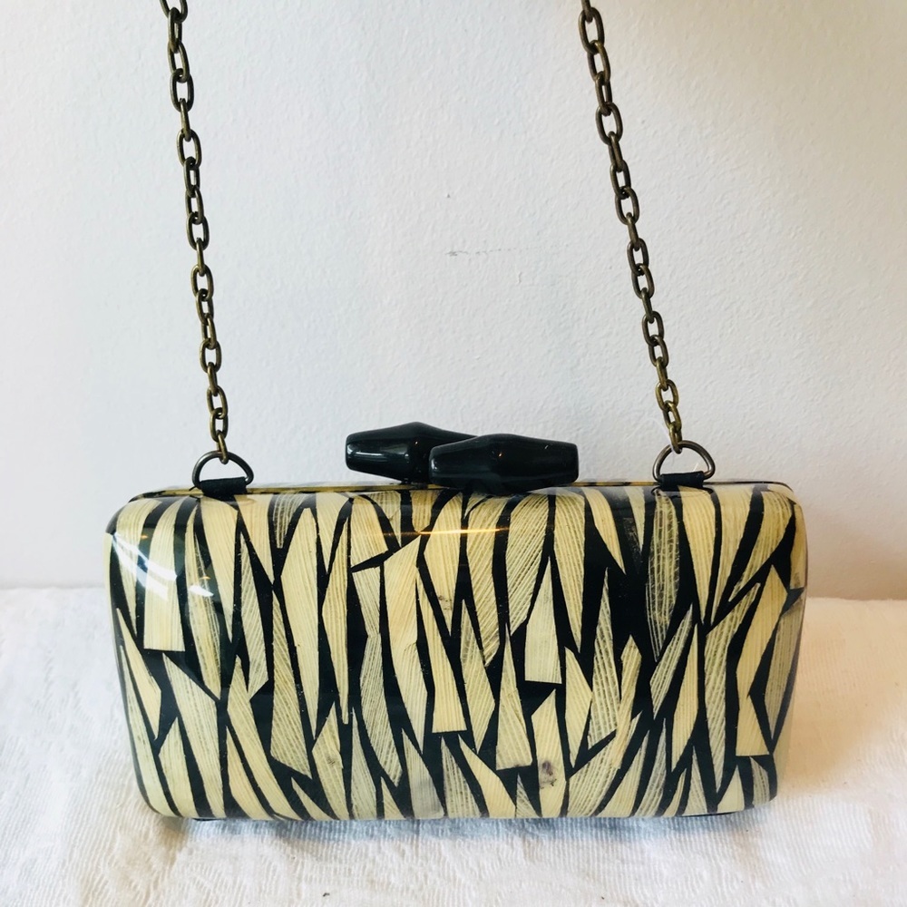 Lacquer Elegant Cutch Handbag**$485